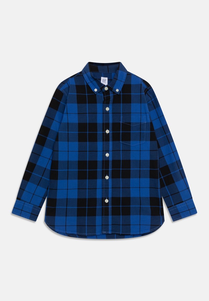 Chemise à manches longues à carreaux bleus et noirs, à boutons, avec col et poche poitrine frontale, posée à plat sur un fond clair.