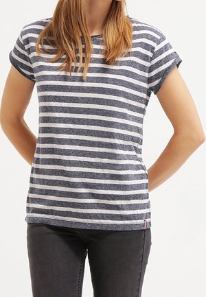 Raidallinen t-paita laivastonsinisenä ja valkoisena, lyhyet hihat, pyöreä pääntie, valmistettu pehmeästä kankaasta. Koristeena vaakasuorat raidat ja sivusauman alapuolella oleva logo.