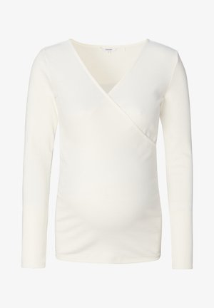 Hvid langærmet graviditetstop med en omslagssilhuet, lavet af ribbet stof. Har V-hals og en tætsiddende silhuet, der kan rumme den voksende mave.