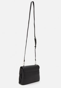 Black crossbody bag made of smooth synthetic material, featuring a structured design, fold-over flap, and adjustable strap with silver hardware.