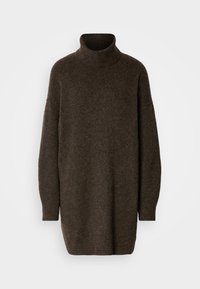 Pullover a collo alto di colore marrone scuro, realizzato in un morbido tessuto texturizzato. Fit oversize con maniche lunghe e spacchi laterali all'orlo.
