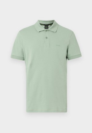Light green short-sleeve polo shirt with collar, two buttons, and subtle BOSS logo on chest, displayed on a plain background.