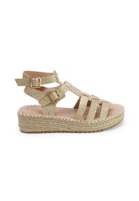 Gold glitter wedge sandals with crisscross straps and adjustable buckles. Jute rope detailing on the sole provides a textured finish.