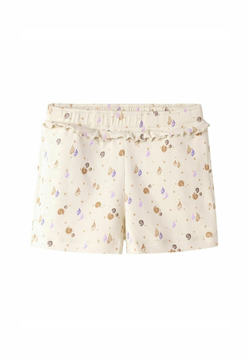 Shorts en coton crème avec une taille élastique à volants. Présente un motif de coquillages et de gouttes en or, violet et marron.