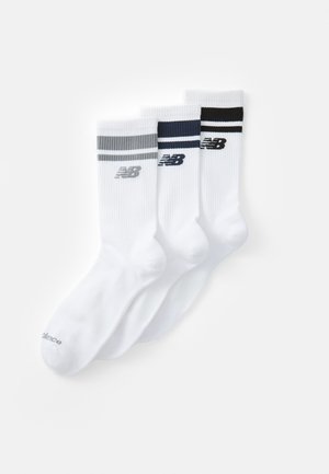 White athletic socks set of three, featuring grey, navy, and black horizontal stripes and ribbed texture. New Balance logo on each sock.