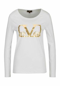 White long-sleeve shirt featuring a large gold metallic graphic with "V" and "1969" in the center. Made of soft, smooth fabric.