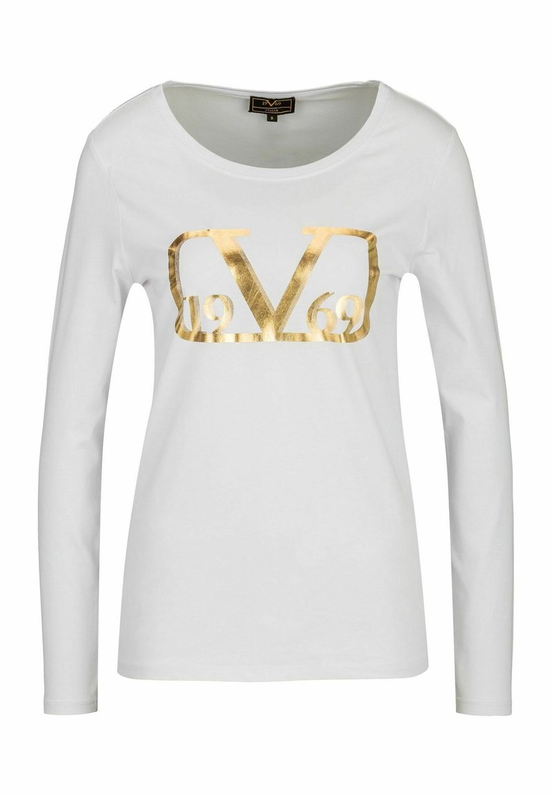 White long-sleeve shirt featuring a large gold metallic graphic with "V" and "1969" in the center. Made of soft, smooth fabric.