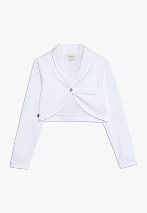 Haut cru blanc avec des manches longues, tissu doux, col à encoches, et un accent de bouton central. Comprend deux boutons latéraux pour la fermeture.