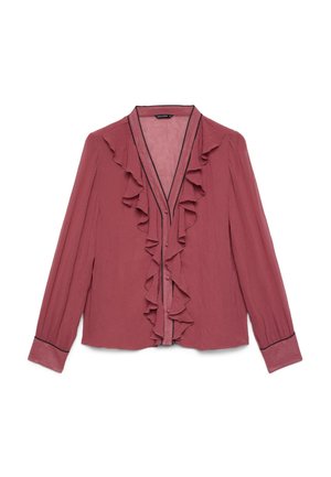 Blouse rose poudrée à manches longues avec col en V à volants, boutonnage devant et bordure noire aux poignets et à l'encolure.