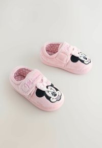 Pink plush slippers featuring a Minnie Mouse design, with polka dot lining and a hook-and-loop strap for easy wear.
