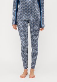 Topp med långa ärmar och leggings i blått med en diamant- och blomm�önster; tillverkad av stretchigt tyg, med kontrasterande sidostråk.