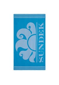 Asciugamano da spiaggia blu con un grande design floreale bianco e il nome del marchio "SUNDEK" in lettering audace, con strisce decorative nella parte superiore.