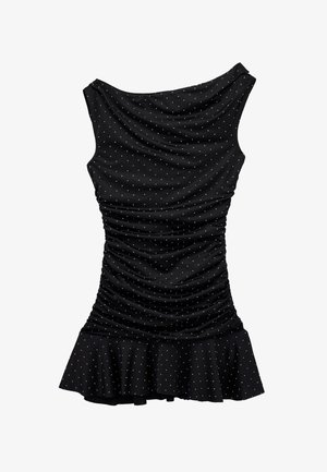 Robe noire sans manches froncée avec des pois blancs et un ourlet à volants, dotée d'un col drapé.