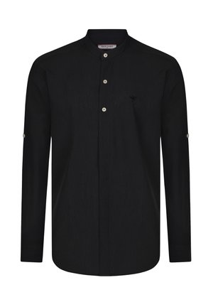 Camisa negra de manga larga con cuello mao, que presenta una tapeta de botones central y un pequeño logo en el pecho. Tejido texturizado.