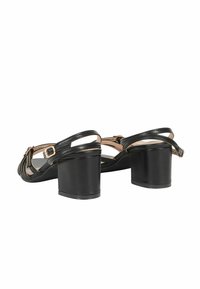 Sandali neri con tacco alto e chunky, caratterizzati da cinturini incrociati e una fibbia regolabile alla caviglia, finitura in pelle liscia.