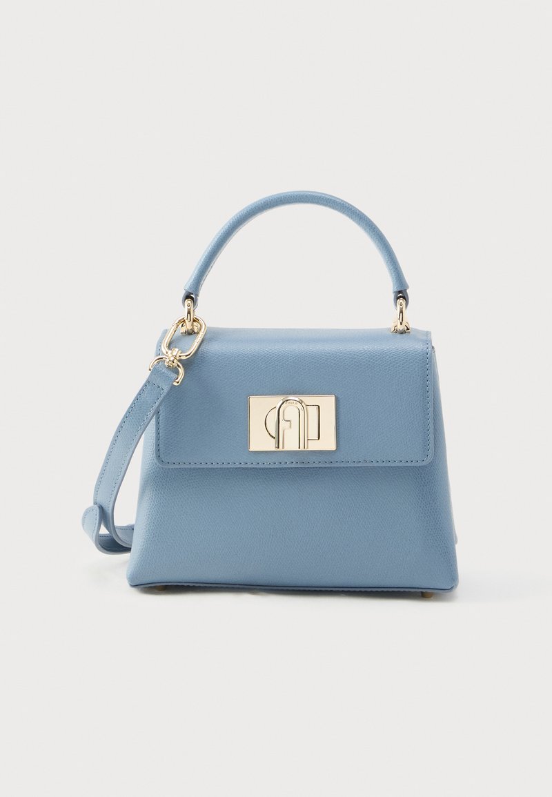 Heleroosa nahast käekott struktureeritud kujuga, ülasang, kuldsed detailid ja reguleeritav õlakott. Esiosas klapiga ja kinnitusega kaas.