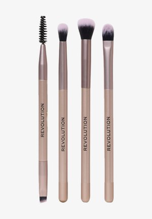 Sæt af fire makeupbørster med metalrose-guld håndtag. Indeholder en spoolie, flad øjenskygge børste, blending børste og detaljeret børste.