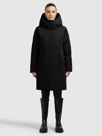 Black padded coat with a hood, featuring a front zip closure and side pockets. The smooth material has a matte finish. Paired with black knee-high boots.