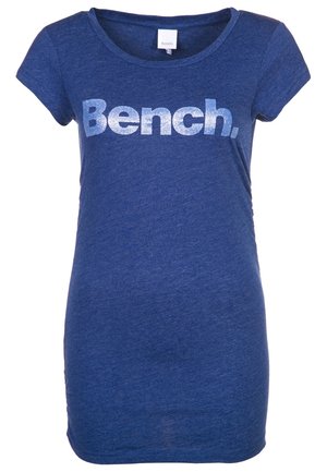 Blue short-sleeve t-shirt with a rounded neckline, featuring a silver glitter "Bench." logo across the front and a soft, textured fabric.