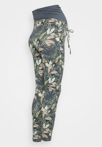 Těhotenské legíny s tmavě modrým pasem, lemované multikolorovým potiskem listů. Elastický materiál, zúžený střih nohavic a nastavitelné šňůrky.