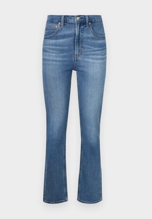Blue denim jeans with a high waist, wide legs, and a subtle fade. Features five pockets and copper accents on buttons and rivets.