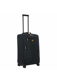 Valigia a rotelle blu navy realizzata in tessuto resistente. Presenta un manico estraibile, diverse tasche con zip e ruote scorrevoli.