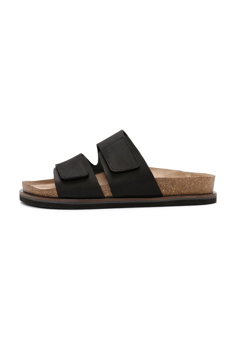 Infradito neri con due fasce regolabili, soletta in sughero e suola in gomma. Presentano una superficie liscia e un design minimalista.