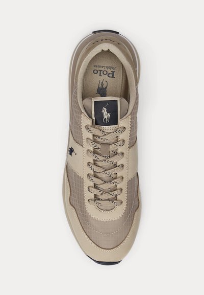 Beige and light brown Polo Ralph Lauren sneaker with laces, logo patch on tongue, and horse player emblem on side and insole.