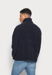 ARKET Camisola de lã polar - navy