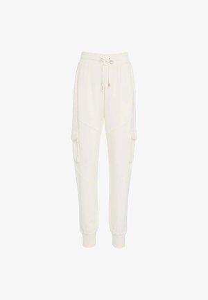 Pantaloni jogger color crema realizzati in tessuto morbido, con vita elastica regolabile, tasche cargo laterali e polsini a coste per una vestibilità affusolata.