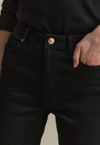 Next Džíny Bootcut - black