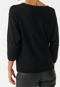 TATUUM Sweter