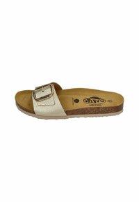 Light beige slide sandal featuring a textured strap with a metallic buckle, cork midsole, and rubber outsole. Soft footbed for comfort.