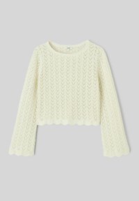 Pull en maille couleur crème avec manches longues évasées, ourlet festonné et motif en dentelle en chevrons, posé à plat sur un fond gris.