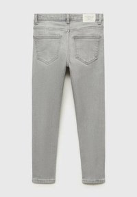 Grå denimbukser med slim passform, med medelhög midja, femfickorsdesign och stickade detaljer på bakfickorna.