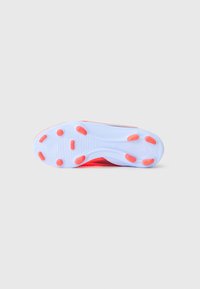 Shoe sole in translucent blue rubber with orange accents. Features textured treads and circular grip patterns for traction.