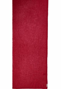 Textile tissé rouge présentant une texture douce et légère avec une qualité légèrement transparente. Bords finis avec une étiquette de marque discrète.