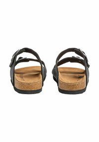Zwarte sandalen met een kurken voetbed, verstelbare banden en een gestructureerd oppervlak. Het ontwerp bevat een eenvoudige gespdetail.