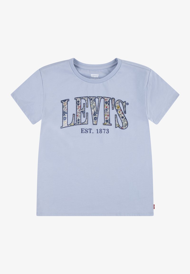 Gaiši zils kokvilnas T-krekls ar ziedu raksta "LEVI'S" logotipu un "EST. 1873" apakšā, ar īsām piedurknēm un apaļu kakla izgriezumu.
