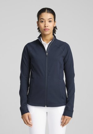 Giacca a zip navy realizzata in tessuto liscio, con tasche laterali e fori per i pollici, con cuciture a contrasto e un piccolo logo sulla manica.