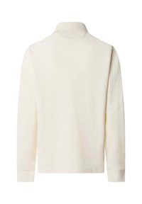 Polo a maniche lunghe in morbido tessuto crema, con colletto, polsini con bottone e un taglio rilassato senza motivi o embellishments visibili.
