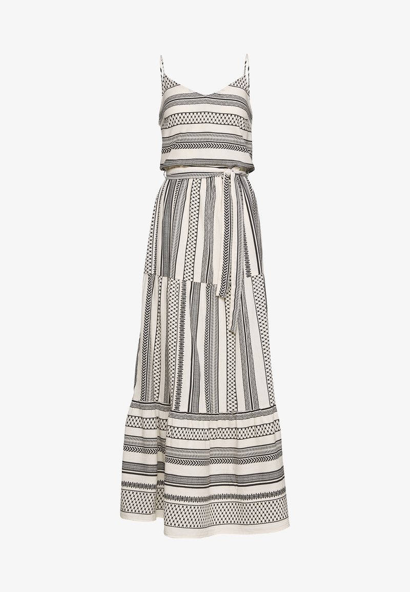 Robe longue sans manches avec des rayures géométriques verticales et horizontales noires et blanches, une ceinture à la taille et une jupe fluide.