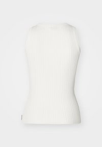 White ribbed sleeveless top with a round neckline. Features a fitted design and subtle texture. No visible patterns or hardware.