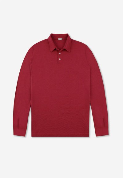 Langs)mouw polo-shirt in dieprode gebreide stof met een kraaghals, een drieknoopsluiting en geribbelde mouwen.