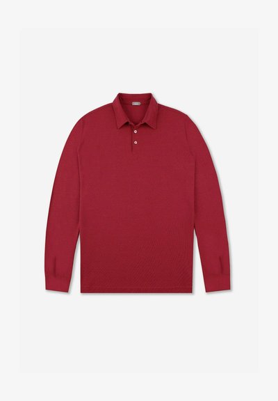 Langs)mouw polo-shirt in dieprode gebreide stof met een kraaghals, een drieknoopsluiting en geribbelde mouwen.