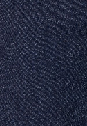 Tela de mezclilla azul oscuro con patrón de tejido diagonal y textura moteada blanca en toda la superficie.