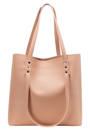 Tan tote bag made of textured faux leather with two handles. Features top stitching and three decorative rivets on each side.