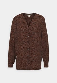 Blouse à imprimé léopard marron et noir avec manches longues, décolleté en V et fermeture à boutons. Tissu léger avec une apparence légèrement texturée.