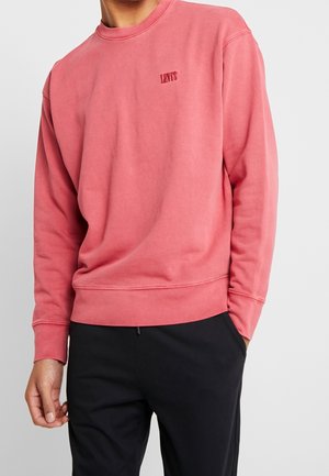 Sweatshirt rose en mélange de coton, avec un col rond, des poignets et un ourlet côtelés, portant un petit logo "Levi's" sur la poitrine.