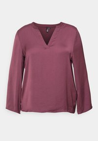Top a maniche lunghe di un profondo colore malva con scollatura a V, morbida texture e spacchi laterali all'orlo per facilitare i movimenti. Tessuto leggero.